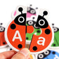Joc cognitiv de asociere a literelor – Puzzle din lemn „Gărgărițe” (52 piese)